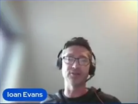 Ioan Evans wearing glasses and a headset, with his webcast name label visible.