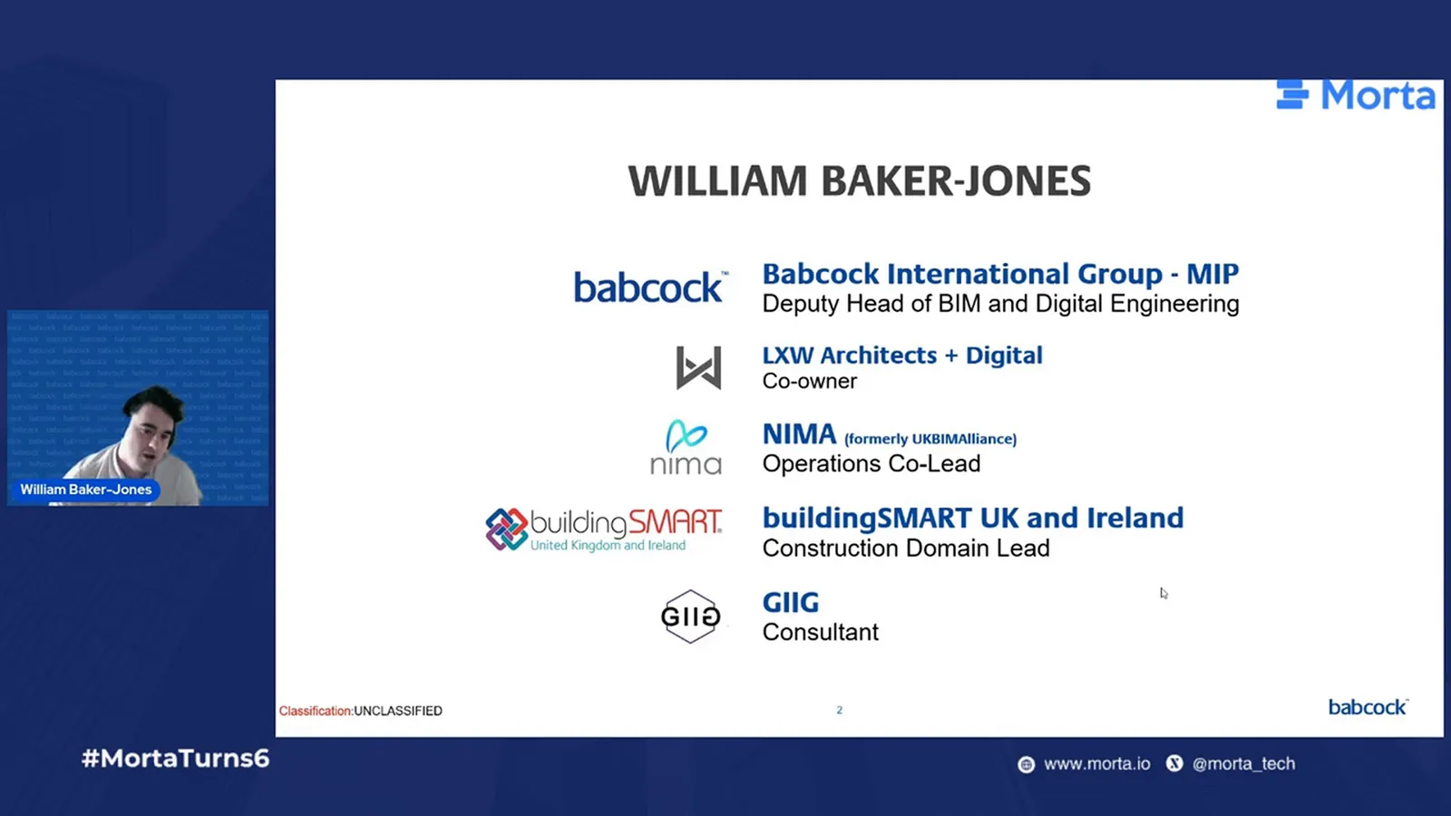 William Baker-Jones beside his introduction slide, listing his Babcock International Group role and other industry roles.